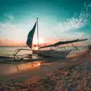 white boat docked on seashore