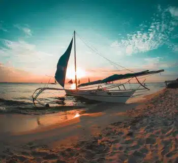 white boat docked on seashore